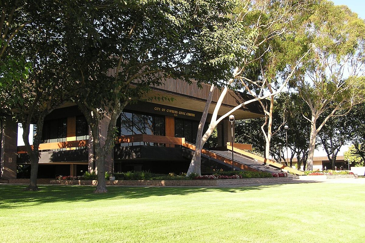 Cypress Civic Center building among tall trees in Cypress, California