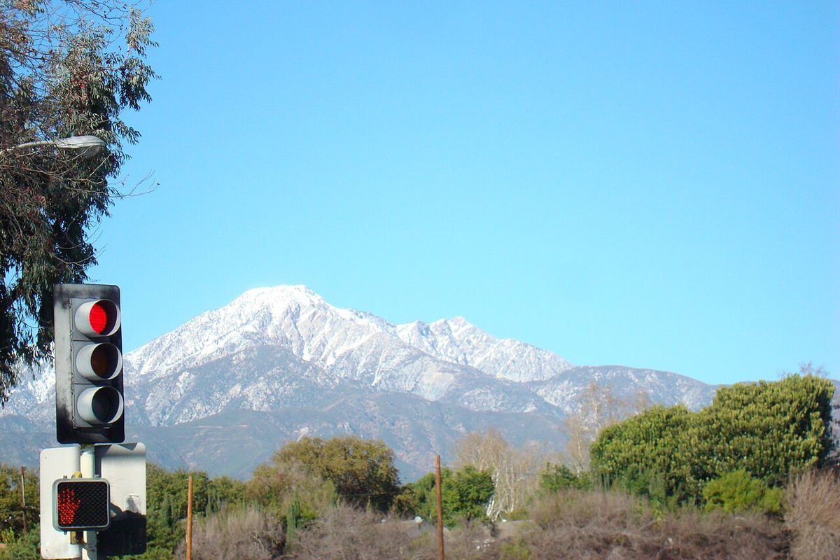 Snow-capped San Gabriel Mountains seen from Grove Avenue and Foothill Boulevard in Upland, California